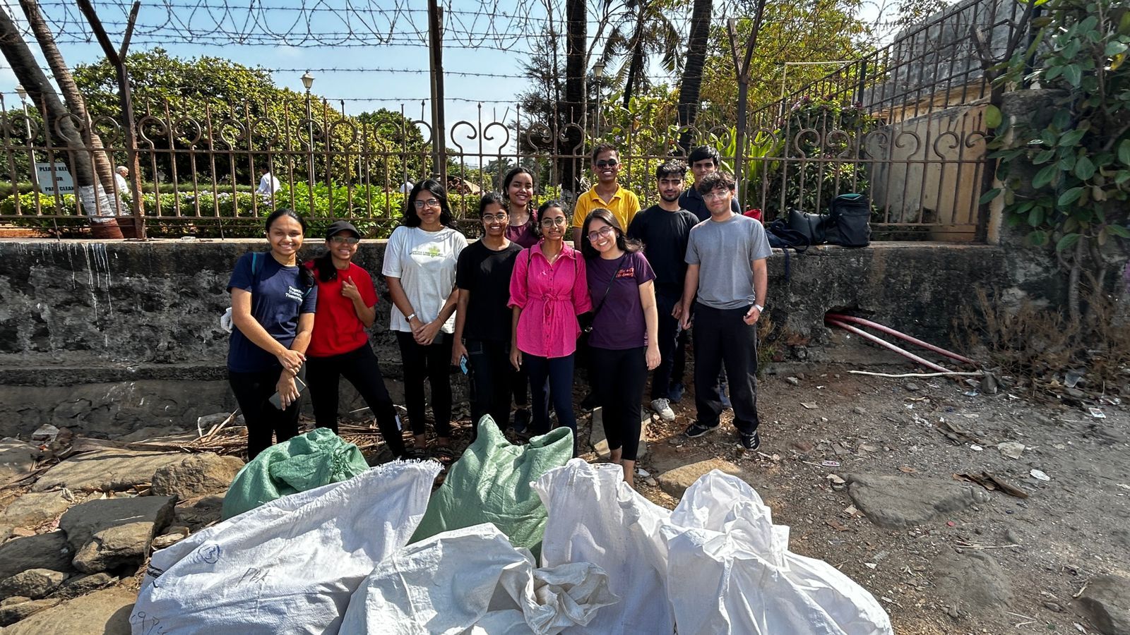 Volunteers with sacks of recovered plastic