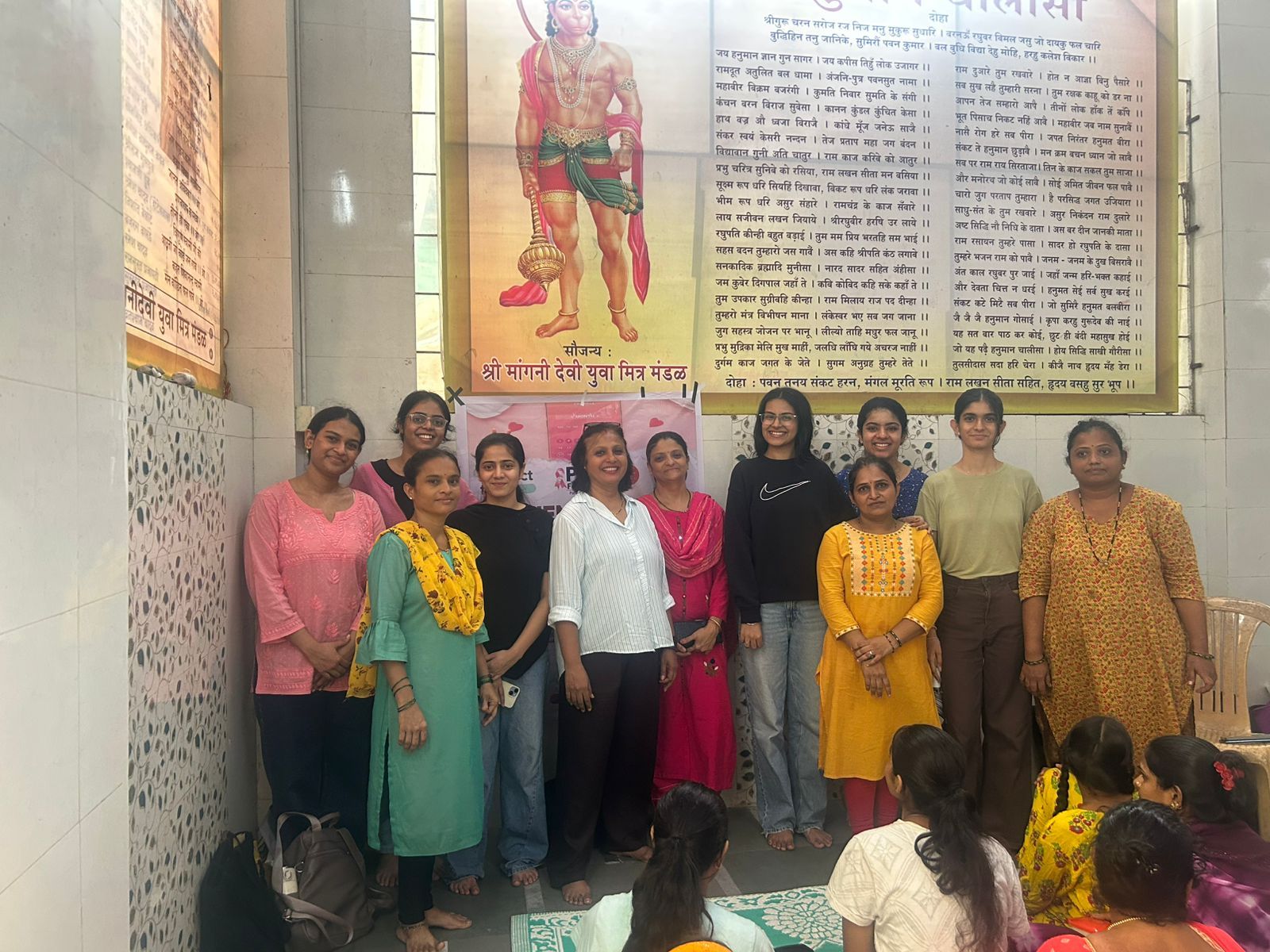 Enactus volunteers with women at a menstrual hygiene session