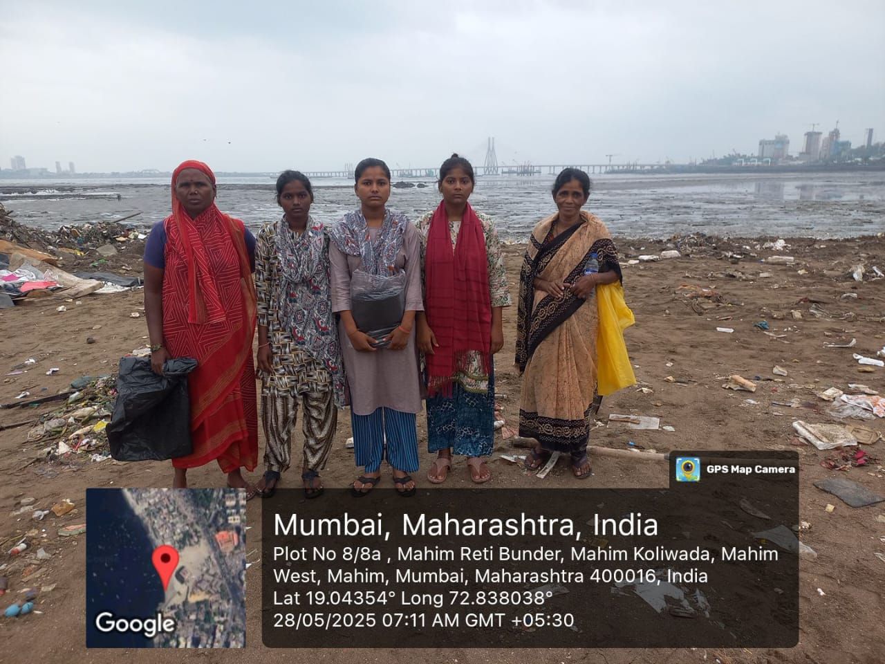 Women waste-pickers on the shore at Mahim Reti Bunder